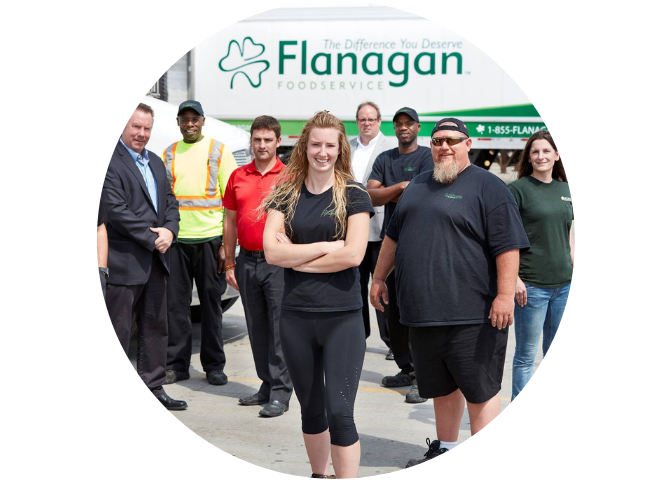 Group of Flanagan drivers smiling with truck in background